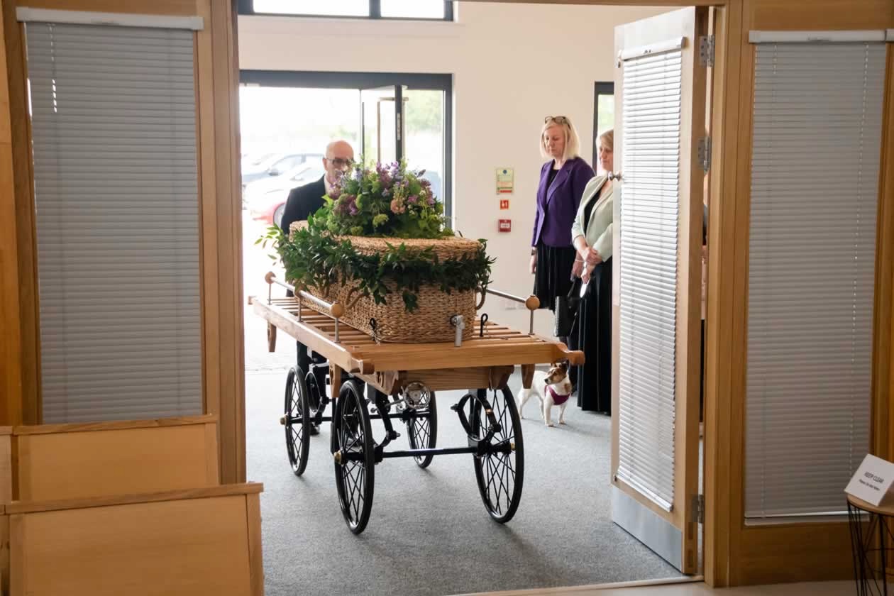 coffin is brought into brewsterwells crematorium on a bier