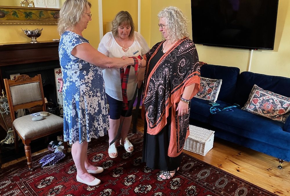 A celebrant performs a handfasting ritual to symbolically bind two people from the two nations